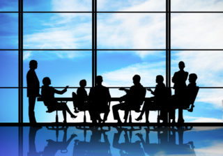 Silhouette of corporate leaders in a meeting