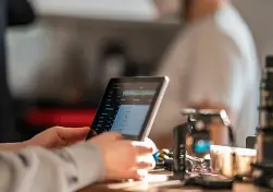 redefining coaching image - hands on a tablet